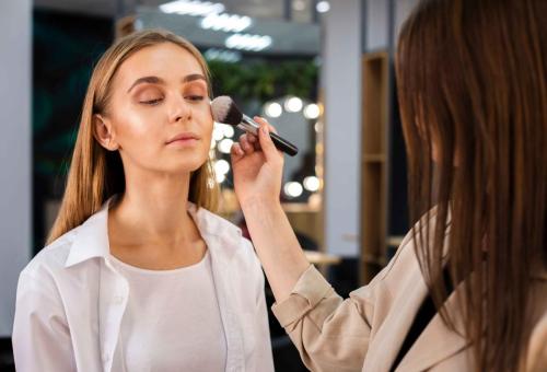 make-up-artist-applying-powder-face-with-brush